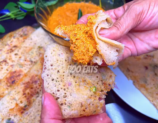 Eating Rulan Dosa With Coconut Chutney